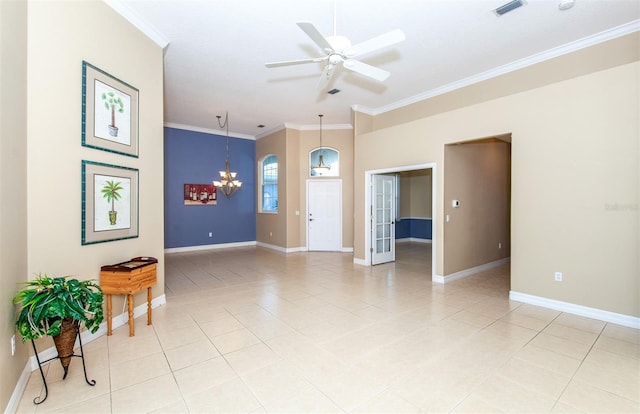 spare room featuring ceiling fan with notable chandelier, crown molding, and light tile patterned floors