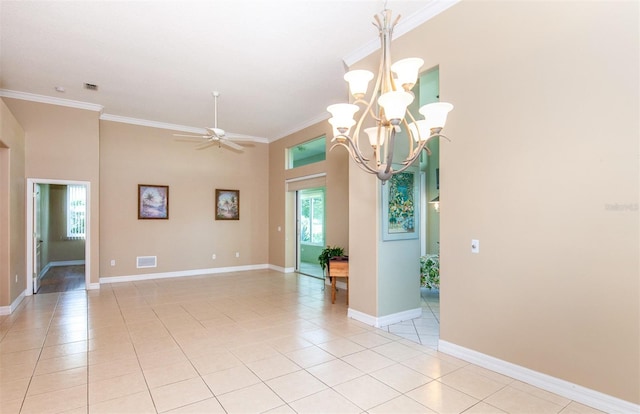 empty room featuring ornamental molding, light tile patterned floors, and ceiling fan with notable chandelier