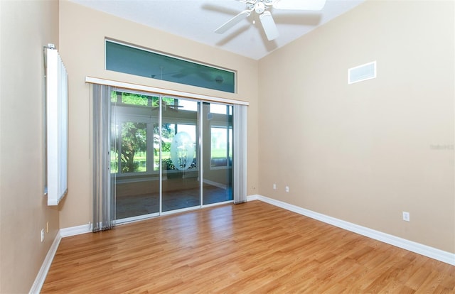 spare room featuring light wood-type flooring and ceiling fan