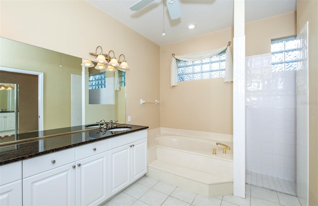 bathroom featuring ceiling fan, vanity, plenty of natural light, and tile patterned floors