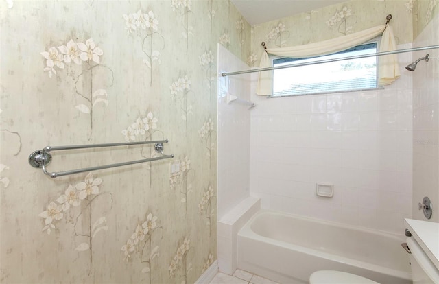 full bathroom featuring toilet, vanity, and tiled shower / bath combo