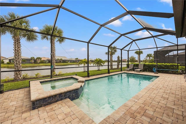 view of pool with a patio, a water view, a lanai, and an in ground hot tub