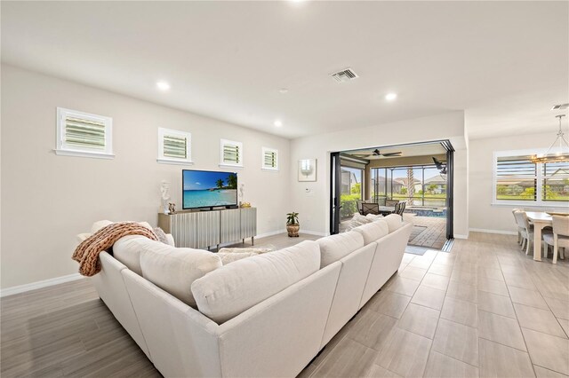 living room featuring a notable chandelier