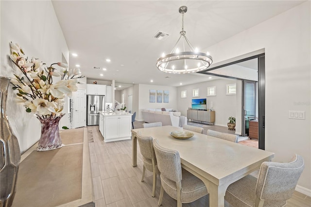 dining area featuring light wood-type flooring