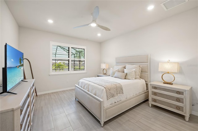 bedroom featuring light hardwood / wood-style flooring and ceiling fan