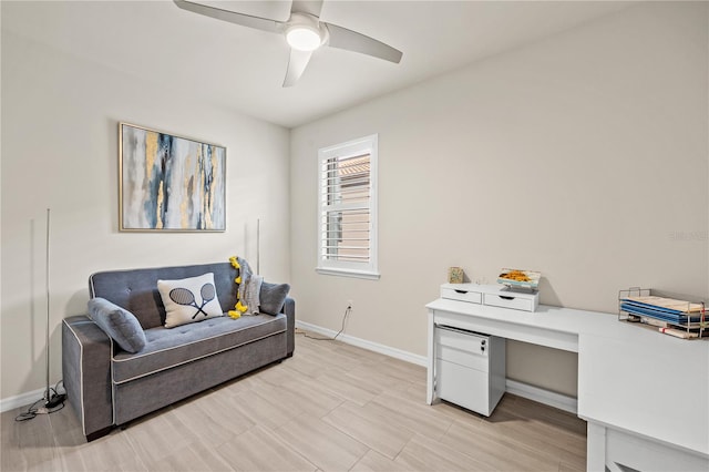 home office with ceiling fan and light hardwood / wood-style flooring