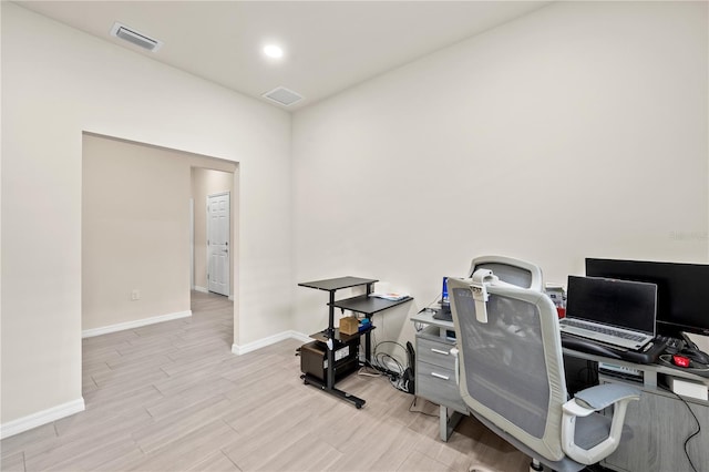 office space with light wood-type flooring