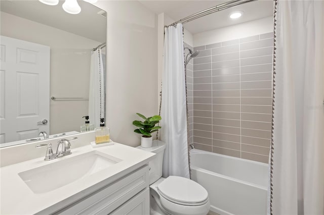 full bathroom with shower / bath combination with curtain, vanity, and toilet