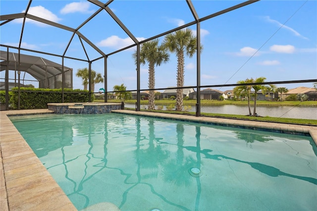 view of swimming pool featuring glass enclosure and a water view