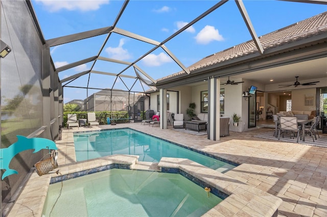 view of pool with glass enclosure, an outdoor living space, ceiling fan, and a patio area