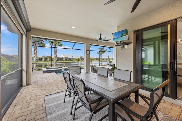 sunroom with ceiling fan