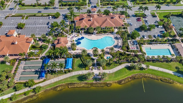 birds eye view of property with a water view