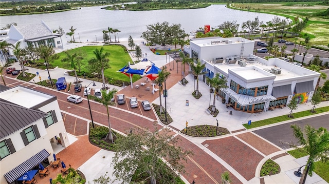 birds eye view of property with a water view