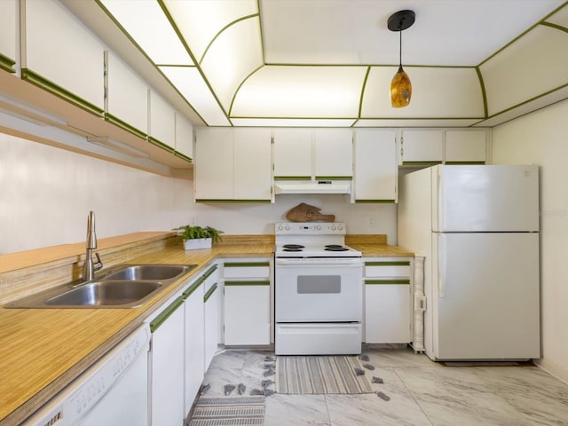 kitchen featuring hanging light fixtures, white appliances, white cabinetry, and sink