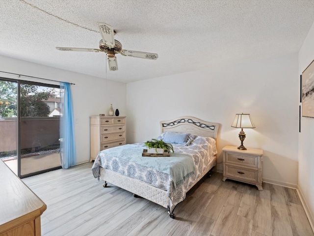 bedroom featuring ceiling fan, a textured ceiling, light hardwood / wood-style flooring, and access to exterior