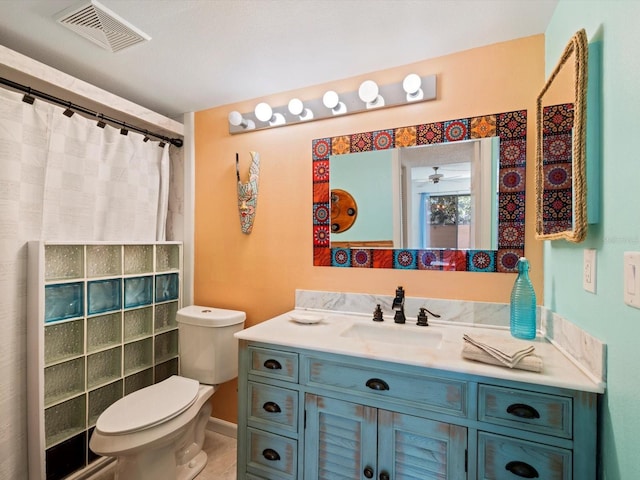 bathroom featuring ceiling fan, a shower with curtain, vanity, and toilet