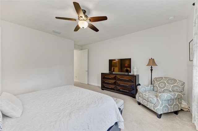 bedroom featuring ceiling fan and light colored carpet