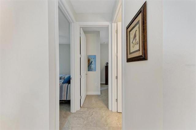 hall with light tile patterned flooring