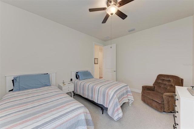 bedroom with light carpet and ceiling fan