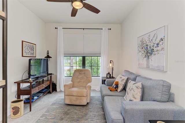 carpeted living room featuring ceiling fan