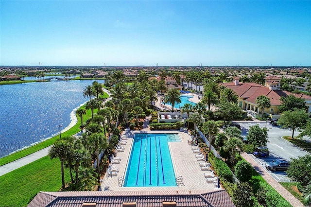 view of pool featuring a water view