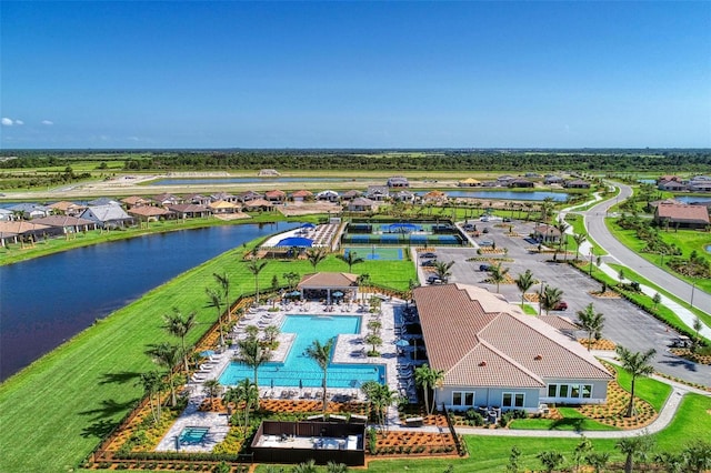 birds eye view of property with a water view