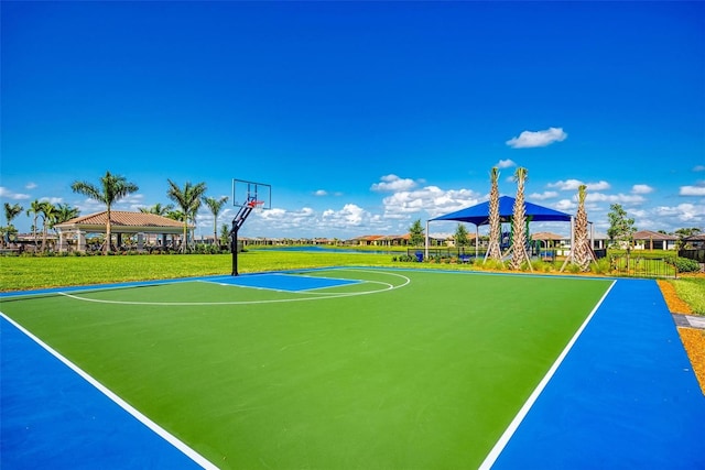 view of basketball court with a gazebo and a yard