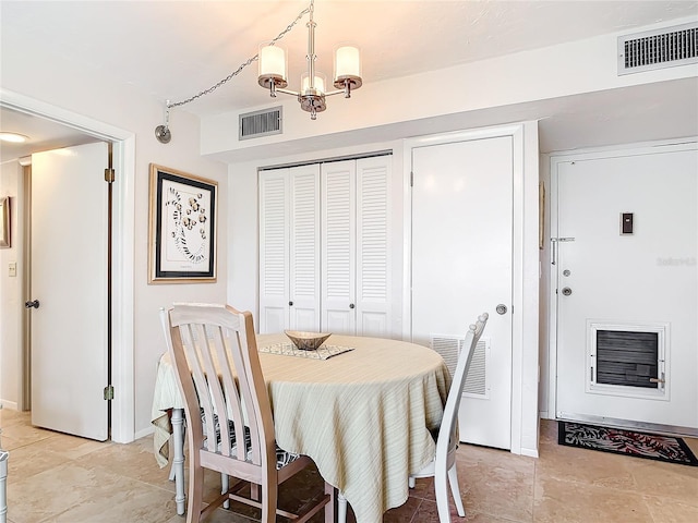 dining room featuring a notable chandelier