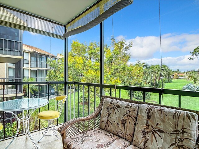 618 Bird Bay Dr S Unit 202, Venice, FL 34285 - sunroom with outdoor lounge area