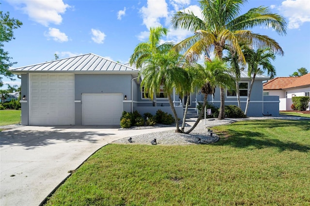 single story home featuring a garage and a front lawn