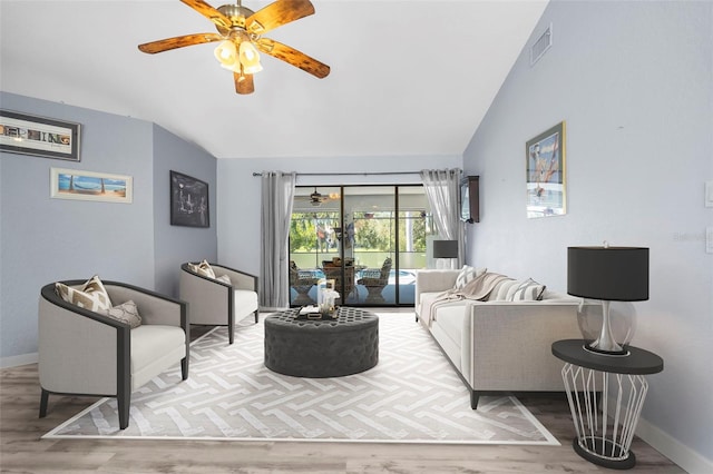 living room featuring wood-type flooring, vaulted ceiling, and ceiling fan