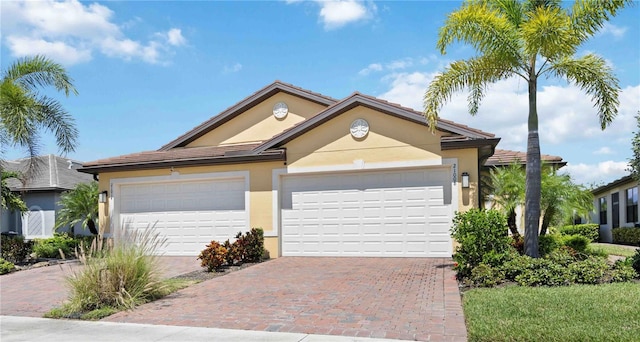 ranch-style house featuring a garage