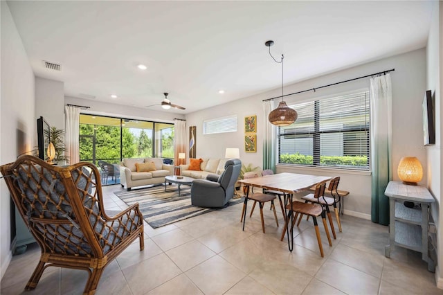 tiled living room featuring ceiling fan