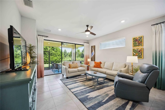 tiled living room featuring ceiling fan