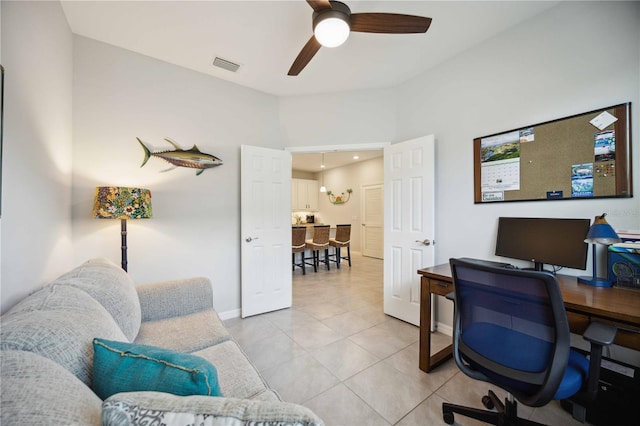 tiled office featuring ceiling fan