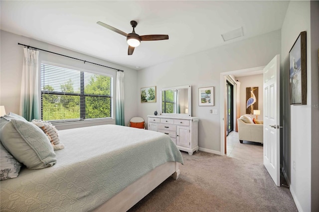 bedroom featuring light carpet and ceiling fan