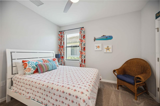 bedroom featuring vaulted ceiling, dark colored carpet, and ceiling fan