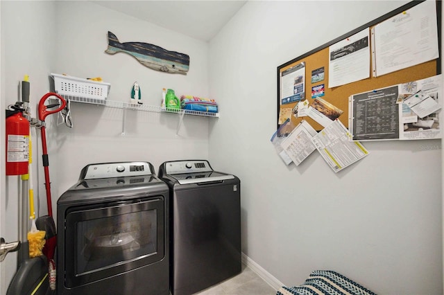 washroom with washing machine and dryer