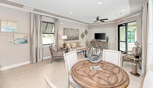 living room with light tile patterned flooring, ornamental molding, and ceiling fan