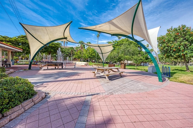 view of property's community with a patio area