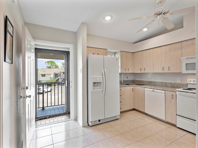 kitchen featuring white appliances, ceiling fan, light brown cabinetry, and light tile patterned flooring