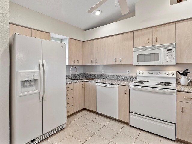 kitchen featuring white appliances, ceiling fan, light brown cabinets, and light tile patterned floors