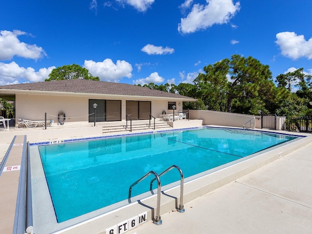 view of swimming pool with a patio area