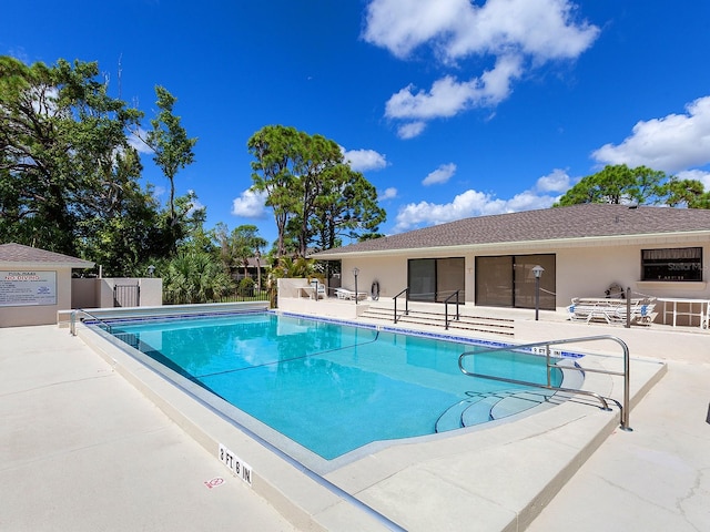 view of swimming pool featuring a patio area