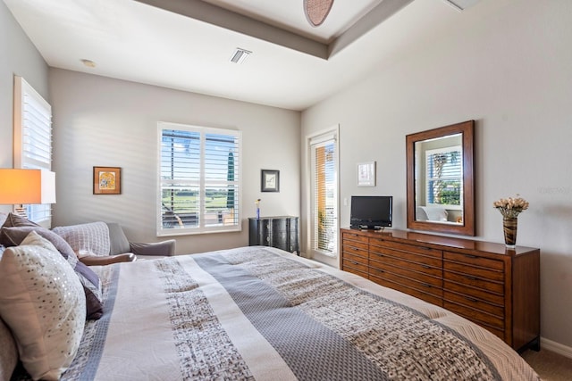 bedroom with baseboards and visible vents