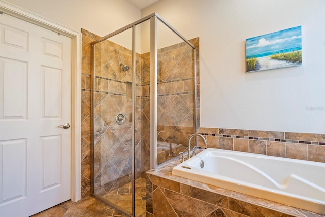 bathroom featuring separate shower and tub