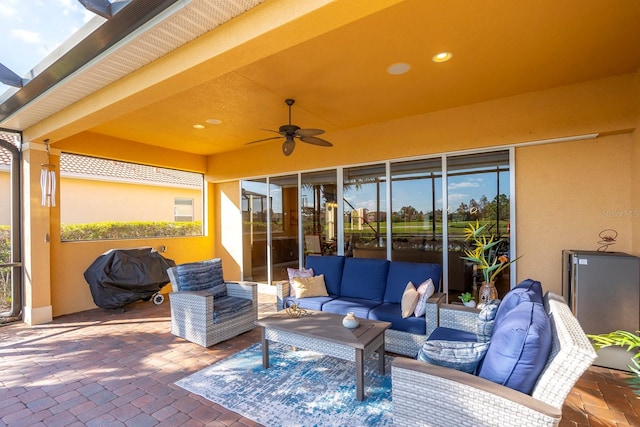 view of patio / terrace featuring ceiling fan, an outdoor hangout area, and a grill