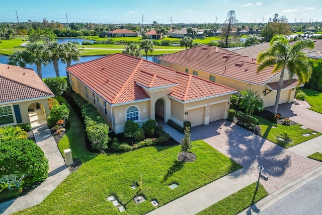 drone / aerial view featuring a residential view and a water view