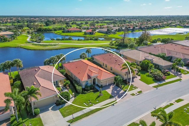 aerial view featuring a residential view and a water view