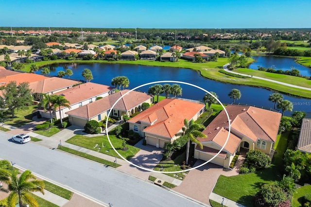 aerial view featuring a residential view and a water view